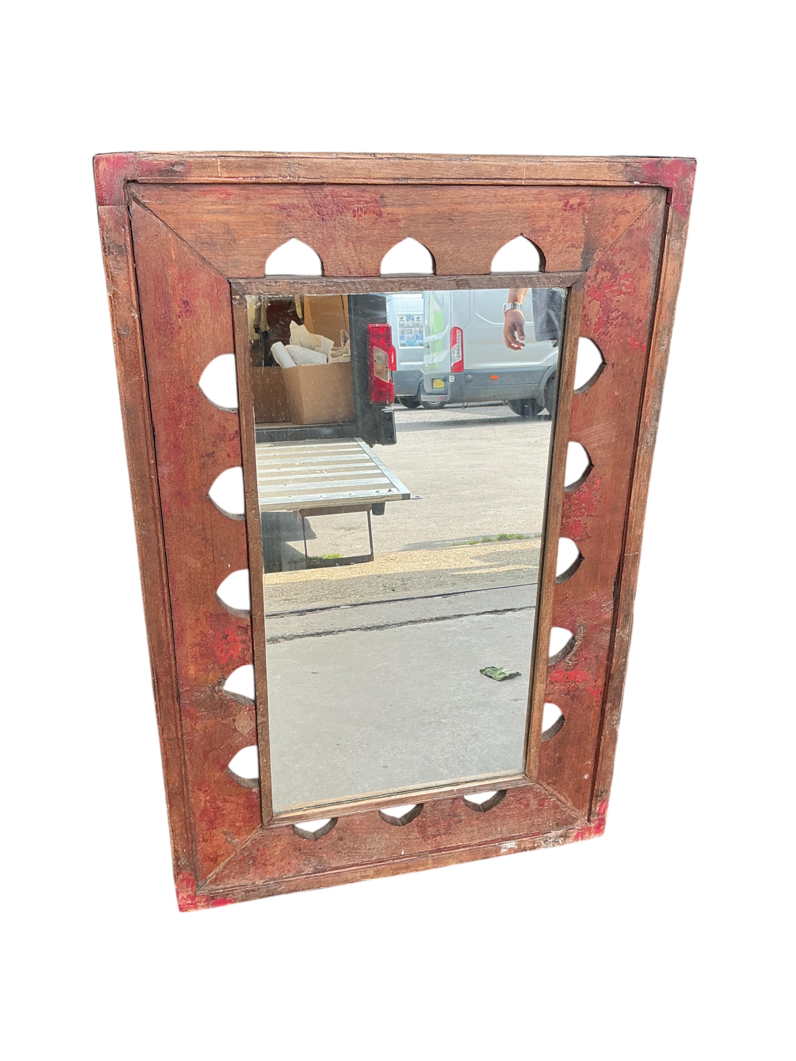 Three modern wall mirrors, of which two with hardwood frames and one carved and painted white, largest width 64cm, height 84cm